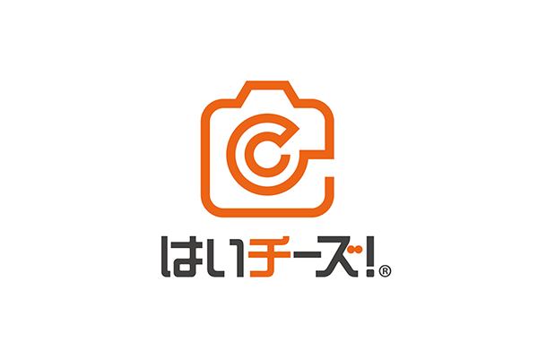 Logo of Sen Corporation featuring an orange camera icon and Japanese text on a white background.
